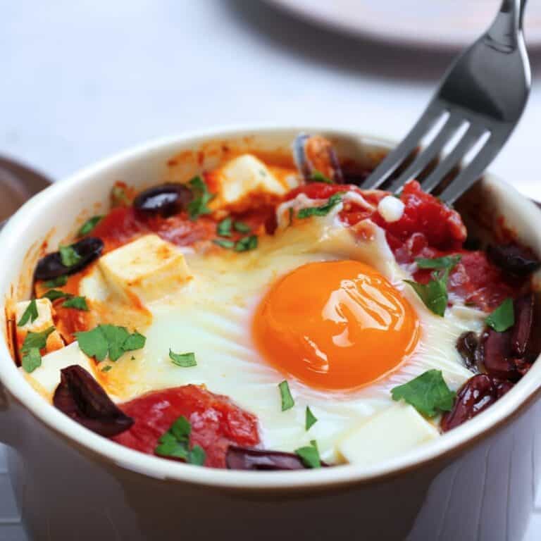 Delicious eggs en cocotte with tomato